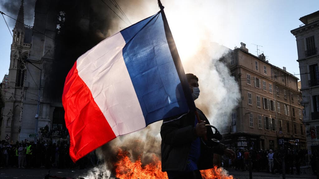 Live: Police crack down as protesters try to raise barricades across France